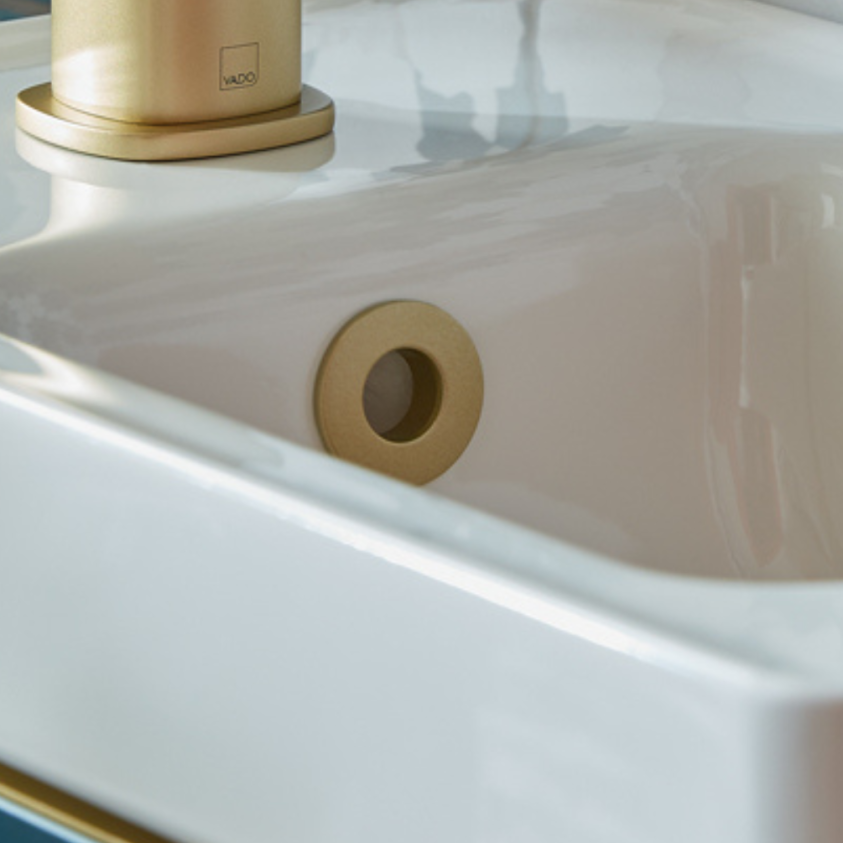 Product lifestyle image close-up of Vado Cameo Satin Brass Ceramic Basin Overflow Cover - CAM-BCO-SBR